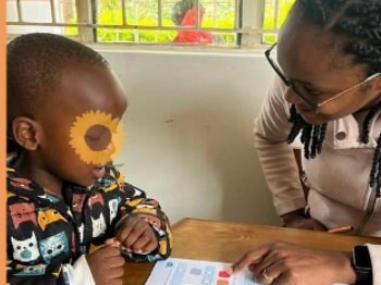 A teacher working one-to-one with a young learner